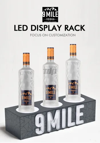 9MILE LED liquor bottle display stand with whiskey bottles on bar counter
