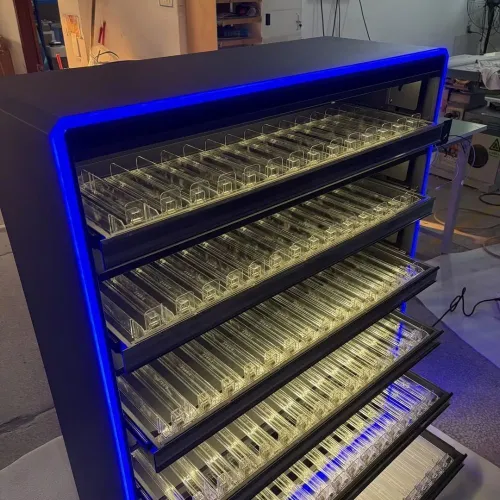 cigarette display rack with pull-out shelves and pushers